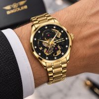 Automatikuhr goldfarben mit schwarzem verspielten Skeleton
