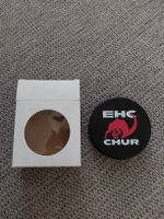 EHC Chur Puck mit Verpackung von Burger King