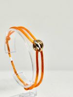Armband, Goldringe an rot/orangefarbener Schnur