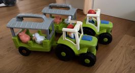 Zwei Fisherprice Traktoren
