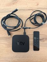 Apple TV box with remote and cables used