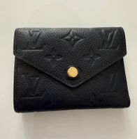 Louis Vuitton Victorine wallet in black empreinte leather