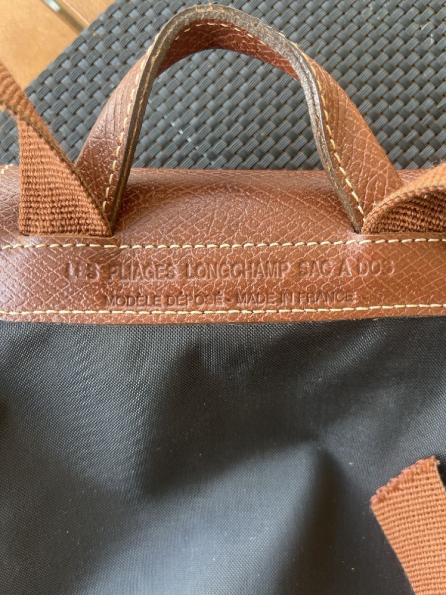 Longchamp Sacs femmes: Sac a dos Longchamp Pliage noir cuir noir  – D'occasion à Vétroz par jer_xgh6 2