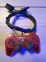 Manette Sony PlayStation 2 filaire rouge translucide