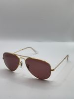 Ray-Ban Aviator gold frame with polarised pink lenses