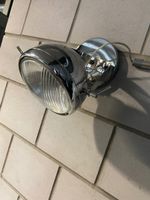 Wandlampe in Form eines alten Motorradscheinwerfers