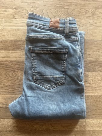 Jean slim clair taille haute comme neuf pour femme