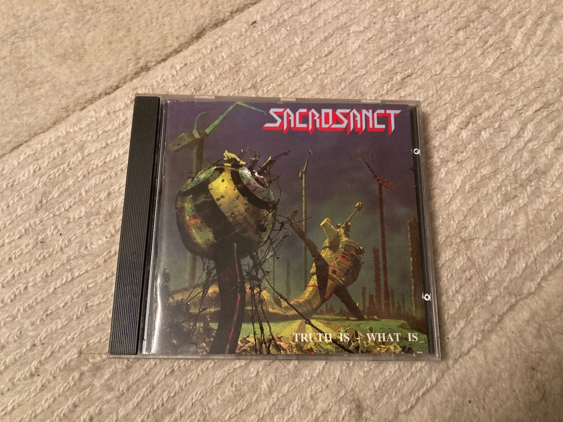 CD: Sacrosanct- Truth is-What is 1990 original – Usato da Wagenhausen venduto da Novafreund283