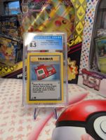 Pokemonkarte Pokédex 1st Edition, 1999 Base Set, CGC 8.5