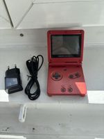 Console Nintendo Game Boy Advance SP rouge avec chargeur