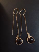 Longues boucles dorées avec perle en verre brun