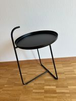Table d'appoint ronde noire en bon état