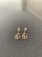 Très jolies boucles d'oreille dorées