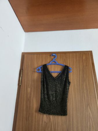 Haut noir et doré à paillettes, taille S