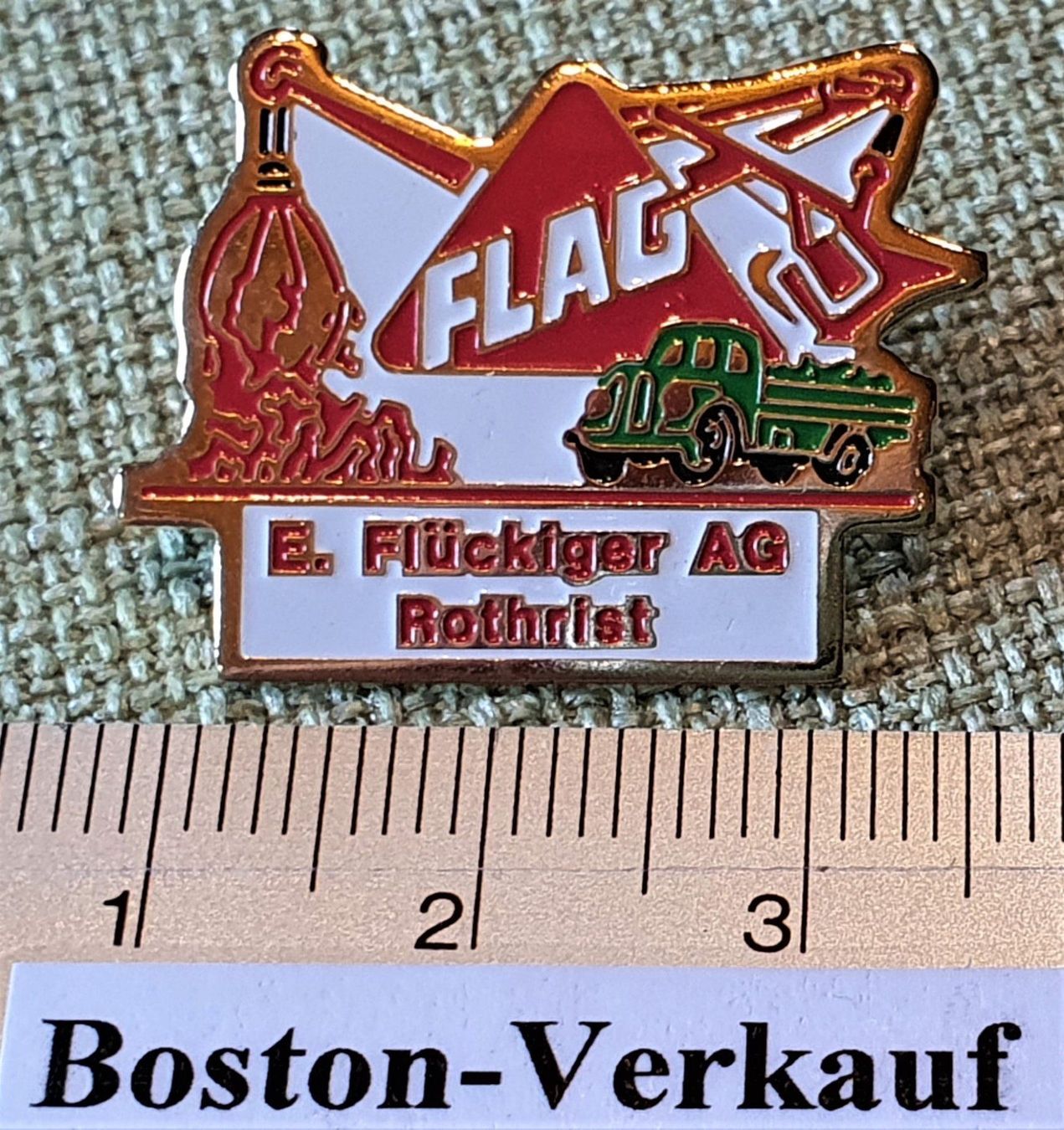 Placchette & Badge: B542 - Pin FLAG E. Flückiger AG Rothrist – Usato da Reinach BL venduto da Boston-Verkauf 1