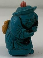 Tabatière en forme de personnage bleu
