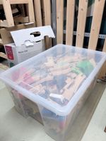 Box full of trains sets and wood pieces