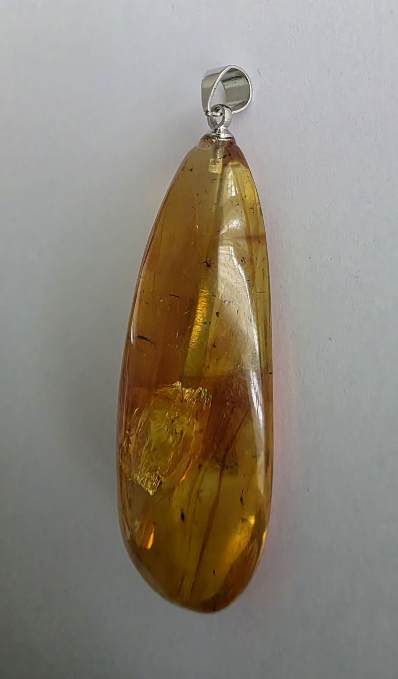 Rimorchi: Bernstein-Anhänger ca. 5x1,7cm. – Nuovo e nell'imballaggio originale da Menziken venduto da Mirager 1