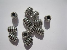 15 Metallperlen mit Rillen 5x7mm