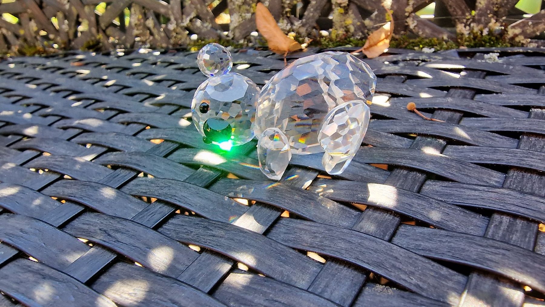 Swarovski Figuren: Swarovski Bär / Panda liegend – Gebraucht aus Wil  AG von Kfloh
