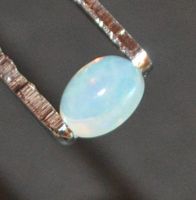 Edelstein L-7114–Äthiopischer Welo Feuer Opal 7x5mm Cabochon