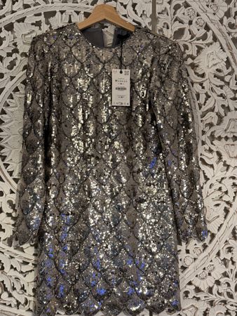 Robe à paillettes argentées taille M état neuf