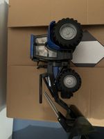 Spielzeug Traktor blau mit Frontlader guter Zustand