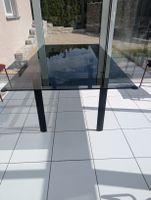 Glass table with black metal legs in good condition 180x100