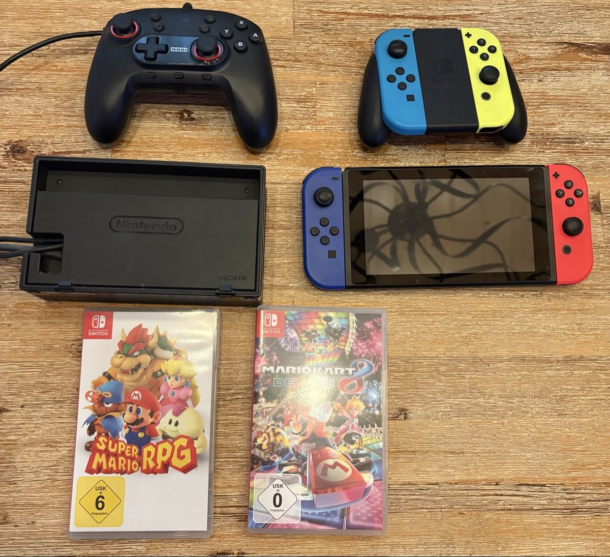 Nintendo Konsolen: Nintendo Switch Konsole | 4 Controller | 9 Games – Gebraucht aus Lachen SZ von doppelg