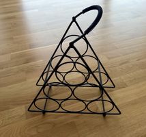 Modern black metal wine rack (holds 5 bottles)