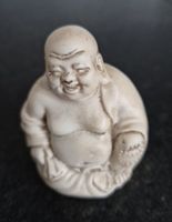 Figur des lachenden Buddha