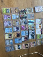 Lot de cartes Pokémon diverses avec étuis de protection