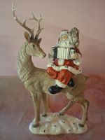 neu: Weihnachtsfigur Weihnachtsmann auf Hirsch mit Akkordeon