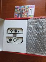 Nintendo Switch Oled + Mario kart 8 + manette suppl.