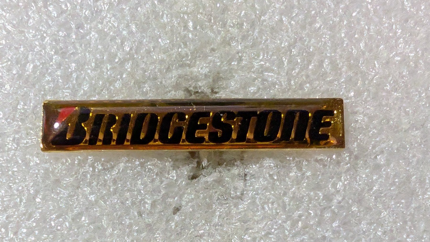 Placchette & Badge: Ansteckpin 211: Bridgestone – Usato da Oppligen venduto da Pin-Fall-Shop
