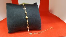 Armband goldfarben mit Herzmotiven und Steinen neu