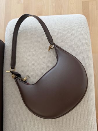 Brown handbag crescent shape new condition