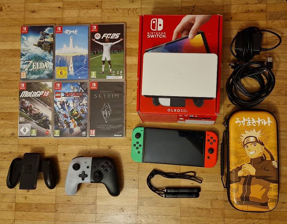 Konsolen: Nintendo Switch OLED + accessoires + 6 jeux + housse – Gebraucht aus Cressier NE von Couleur3