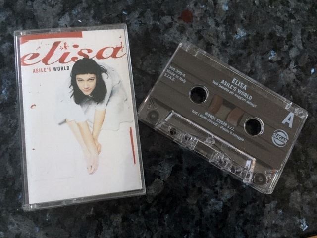 Musicassette: Elisa Asile's World Musikkassette MC – Nuovo e nell'imballaggio originale da Goldach venduto da SSRConzept