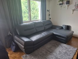 Schwarzes Ledersofa (gebraucht) mit Kopfstütze
