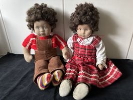 2 hübsche Puppen. Mädchen und Bube.