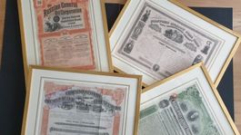 4 Wertpapiere in professionellen Passepartouts.