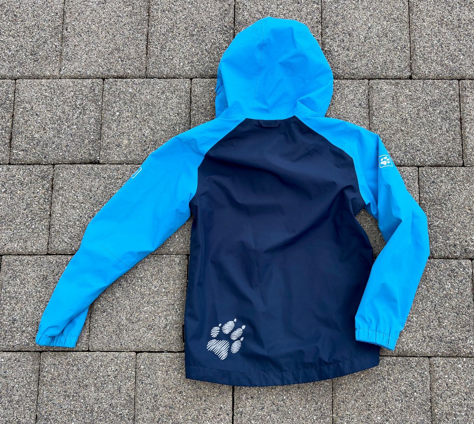 Jack Wolfskin Giacche & Cappotti: Jack Wolfskin Kinderregenjacke, Grösse 140 – Usato da Arni AG venduto da CLIMBIM 1