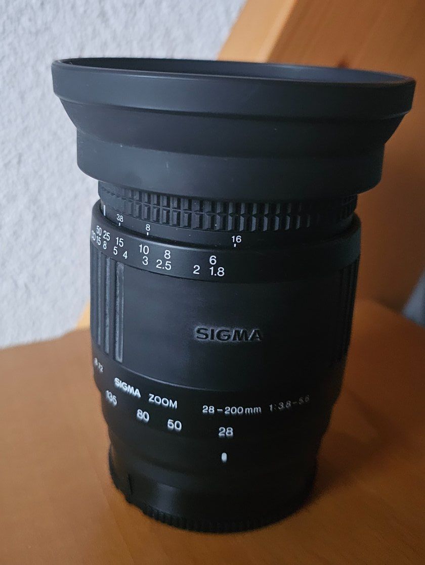 Sigma Obiettivi: SIGMA Zoom 28- 200mm/ Objektiv – Usato da Geuensee venduto da JeMaUrPe