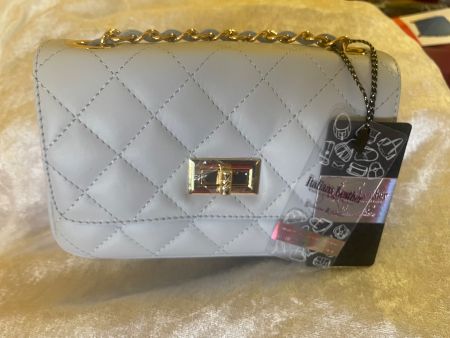 Sac à bandoulière ou à main gris matelassé  cuir neuf