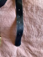 Ceinture en cuir noir boucle dorée