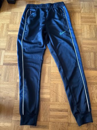 Pantalon de sport Nike, taille XS, noir et turquoise.