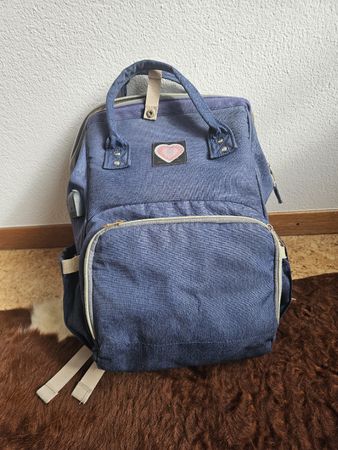 Blauer Wickelrucksack mit vielen Fächern & Kabeldurchführung