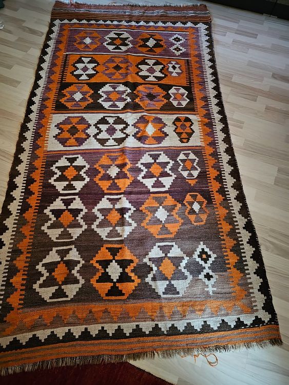 Tapis plat vintage ORIENT MINT à l'aspect usé