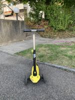 Gebrauchter gelber Oxelo-Dreirad-Roller